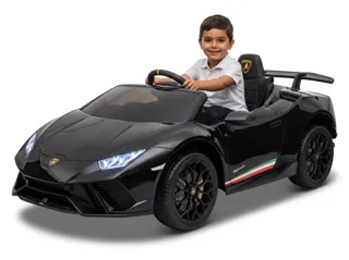 Lamborghini Huracán voiture électrique enfant 12V noire, garçon au volant, trois-quarts avant, phares LED allumés